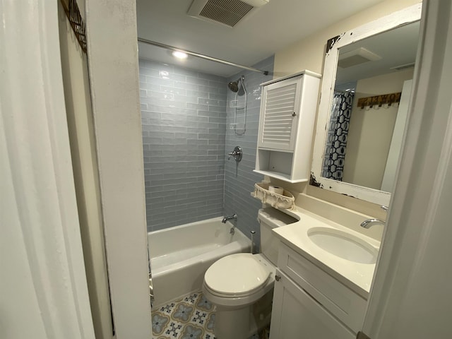 bathroom featuring toilet, vanity, shower / bath combination with curtain, and visible vents