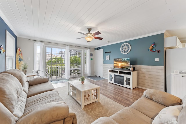 301 E Leaming Ave Unit A, Wildwood, NJ 08260 - living room with crown molding, wainscoting, light wood-style floors, a ceiling fan, and wooden ceiling