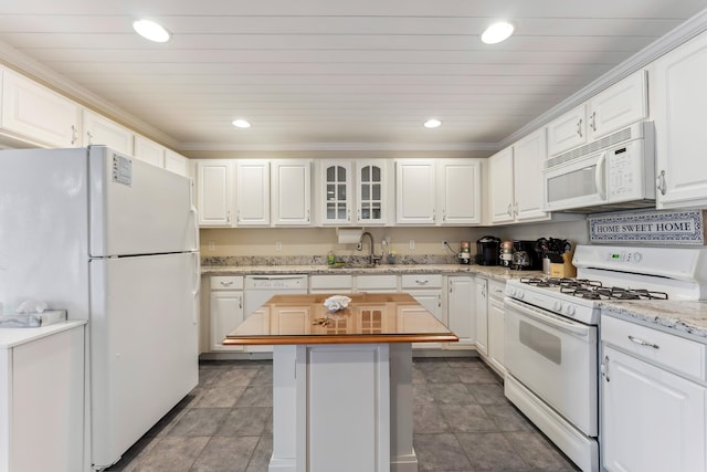 301 E Leaming Ave Unit A, Wildwood, NJ 08260 - kitchen with white appliances, a sink, white cabinets, recessed lighting, and a center island