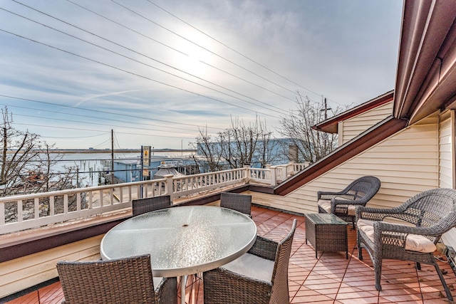 wooden deck featuring a water view