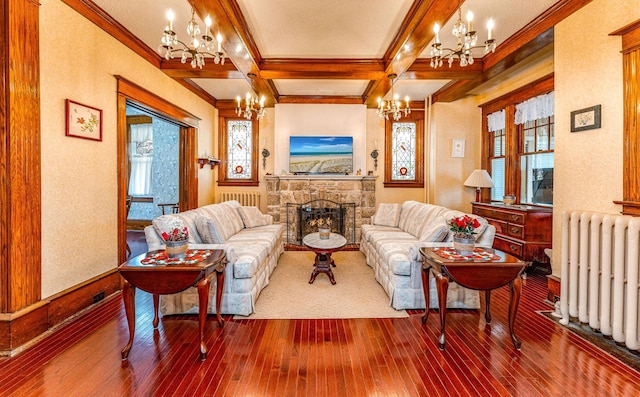 living room with beam ceiling, wood-type flooring, a fireplace, and radiator