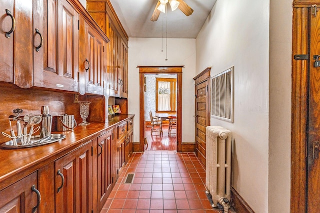 interior space featuring radiator and dark tile patterned flooring