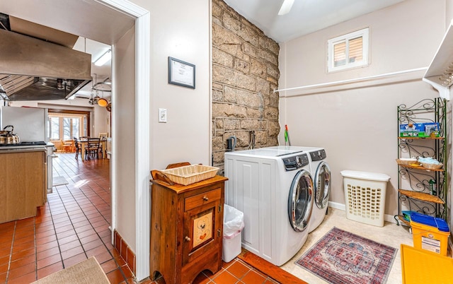 laundry room featuring tile patterned floors and washing machine and clothes dryer