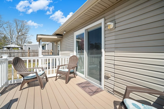 wooden deck featuring fence