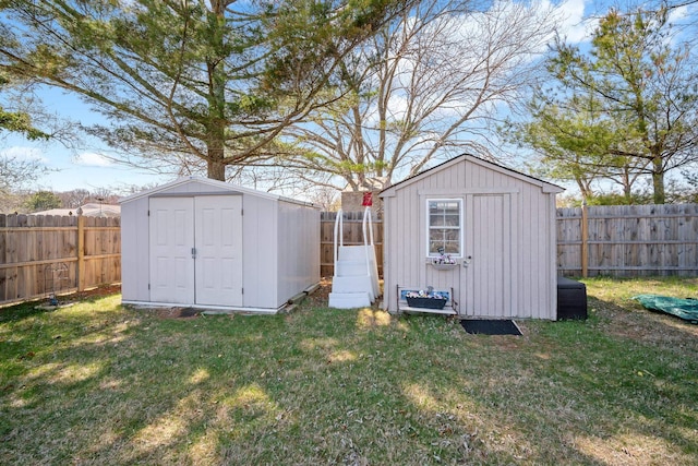 view of shed with a fenced backyard