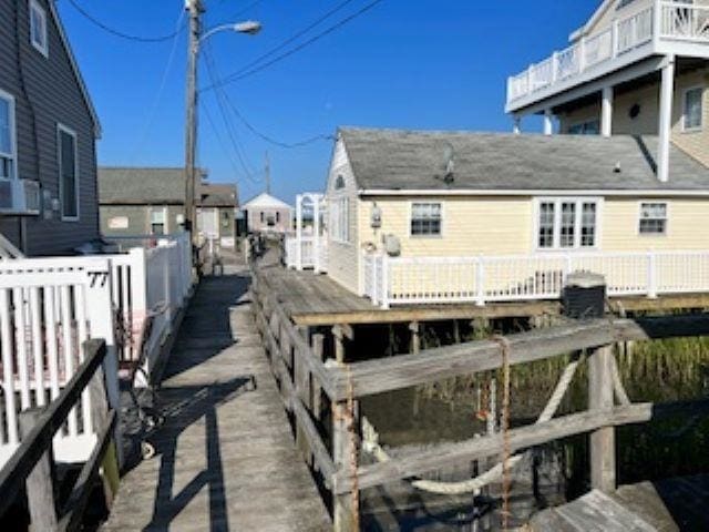 75 W Boardwalk, Grassy Sound, NJ 08260 - rear view of house featuring a wooden deck