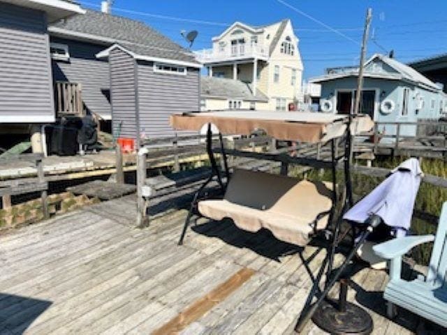 75 W Boardwalk, Grassy Sound, NJ 08260 - wooden deck featuring a storage unit