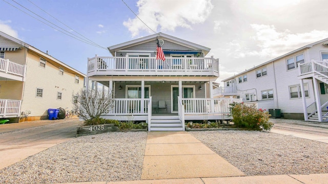 view of front of home with covered porch and central AC