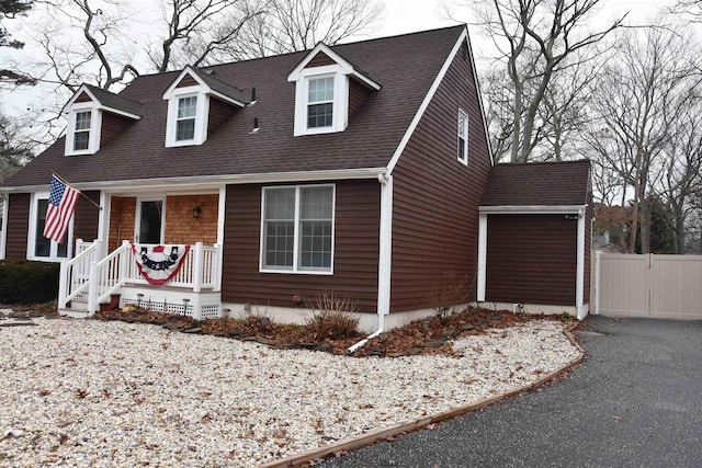 7 Corson Ln, Ocean View, NJ 08230 - cape cod house featuring a porch, asphalt driveway, and a shingled roof