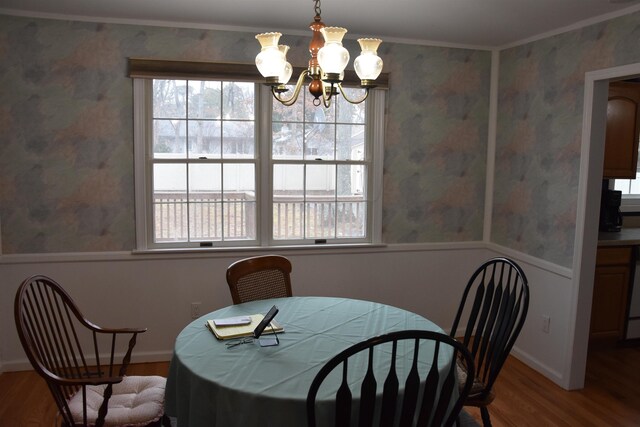7 Corson Ln, Ocean View, NJ 08230 - dining area with wood finished floors, a chandelier, wallpapered walls, crown molding, and a wainscoted wall