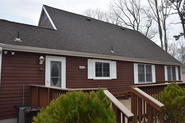 7 Corson Ln, Ocean View, NJ 08230 - back of property with a shingled roof and a wooden deck