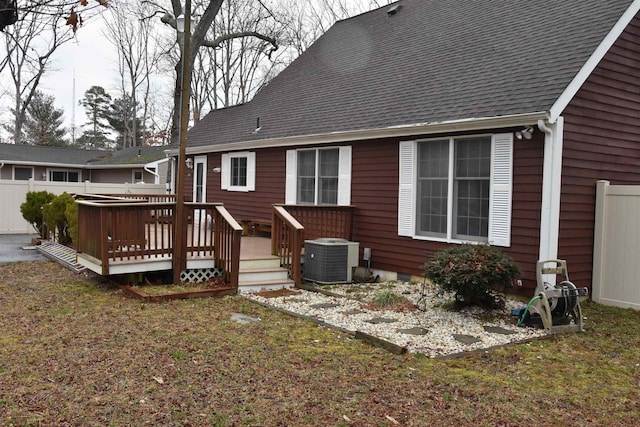 7 Corson Ln, Ocean View, NJ 08230 - rear view of house with central AC unit, a wooden deck, and roof with shingles