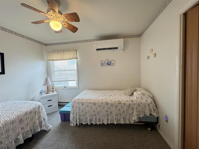 bedroom with ceiling fan, a wall unit AC, ornamental molding, dark carpet, and a baseboard radiator