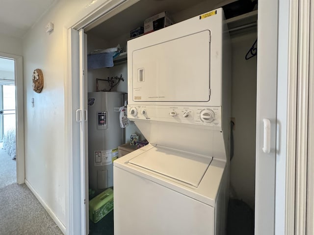 washroom featuring stacked washer / dryer, carpet flooring, and electric water heater