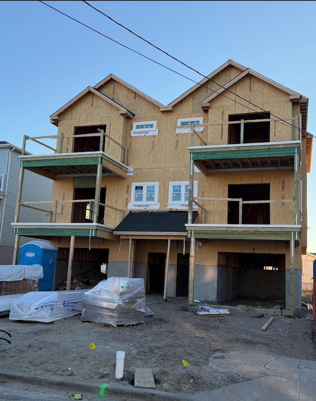 property in mid-construction featuring a balcony