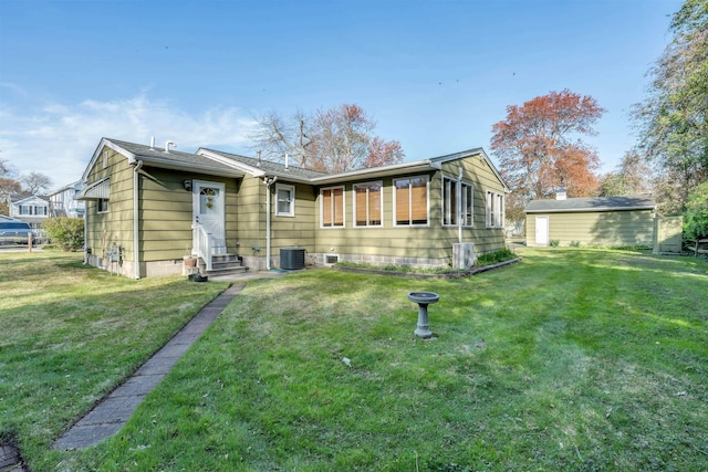 36 W Virginia Ave, Villas, NJ 08251 - rear view of property with central AC, entry steps, and a lawn