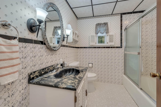 36 W Virginia Ave, Villas, NJ 08251 - full bathroom with vanity, tile walls, toilet, tile patterned flooring, and shower / bath combination with glass door