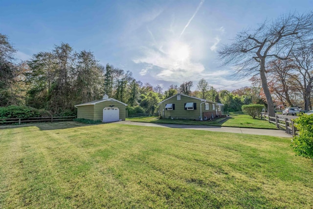 36 W Virginia Ave, Villas, NJ 08251 - view of yard with fence, an outbuilding, aphalt driveway, and a detached garage