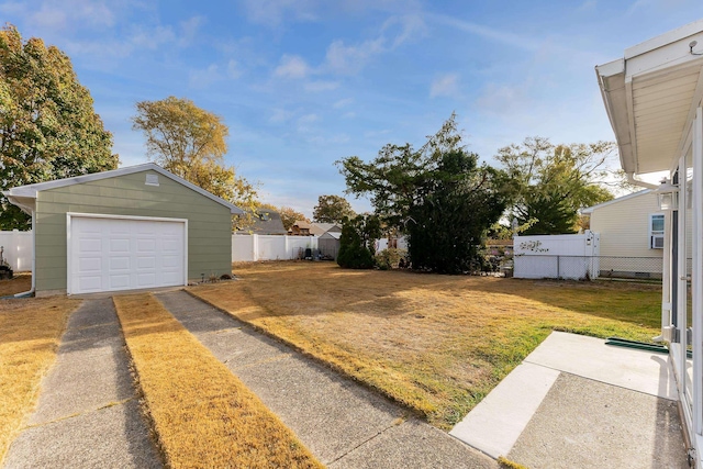 view of yard with an outbuilding and a garage