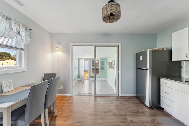 dining area with light wood-type flooring