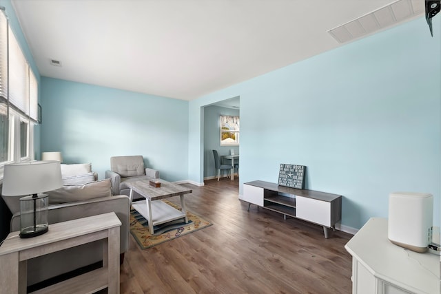 living room featuring dark hardwood / wood-style floors