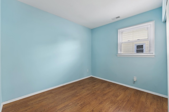 empty room featuring hardwood / wood-style flooring