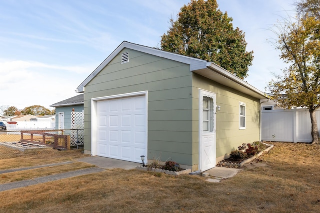 garage with a yard