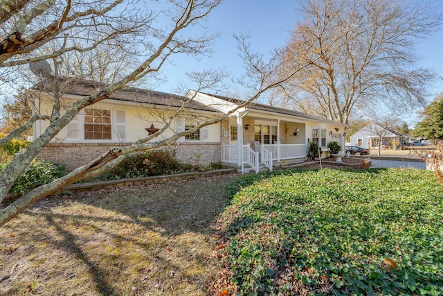 ranch-style home with brick siding and covered porch