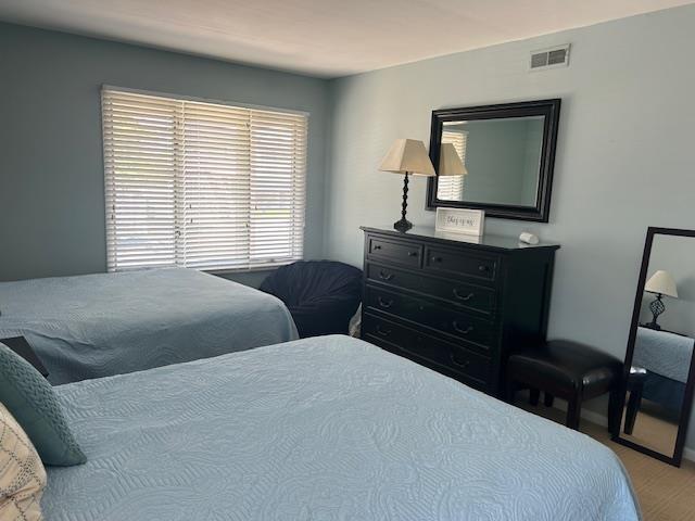 bedroom featuring visible vents