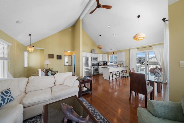 living room featuring high vaulted ceiling, dark wood-style flooring, and a ceiling fan