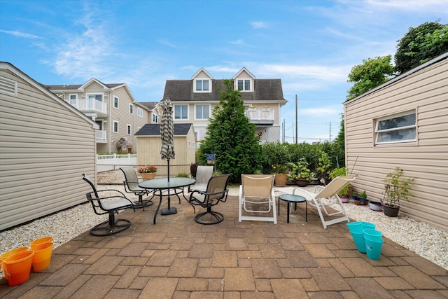 view of patio / terrace with outdoor dining space and fence