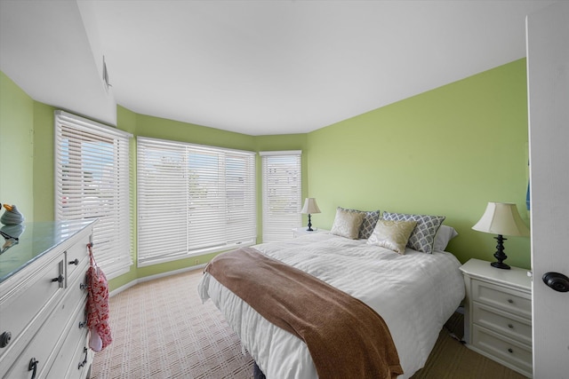 bedroom with light colored carpet