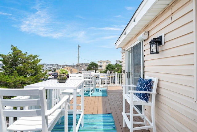 wooden deck with a residential view