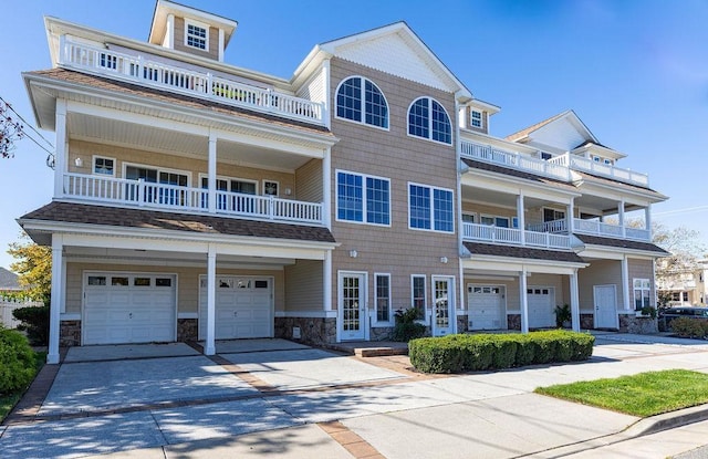 view of front of house with a balcony and a garage