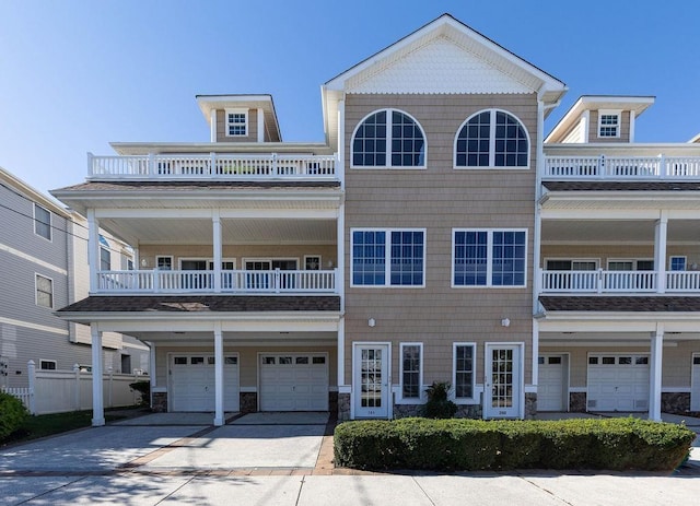 view of front of property with a garage and a balcony