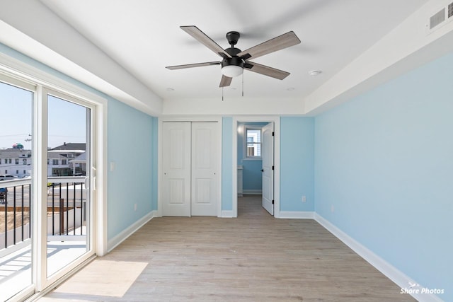 403 E Glenwood Ave Unit 15, Wildwood, NJ 08260 - unfurnished bedroom with access to outside, light wood-style floors, a closet, and a ceiling fan