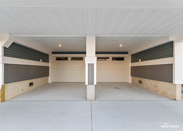 403 E Glenwood Ave Unit 15, Wildwood, NJ 08260 - garage featuring an attached carport and concrete driveway