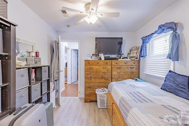 bedroom featuring light wood-type flooring and ceiling fan