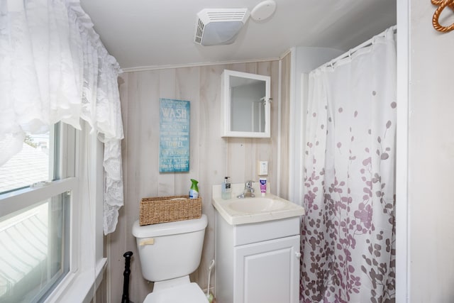 bathroom with visible vents, vanity, and toilet