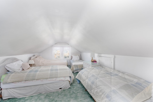 carpeted bedroom featuring vaulted ceiling