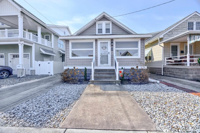 view of front of home featuring fence