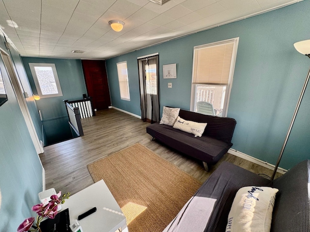living room with wood finished floors and baseboards