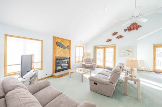 141 8th St, Avalon, NJ 08202 - carpeted living room featuring a fireplace, ceiling fan, and high vaulted ceiling