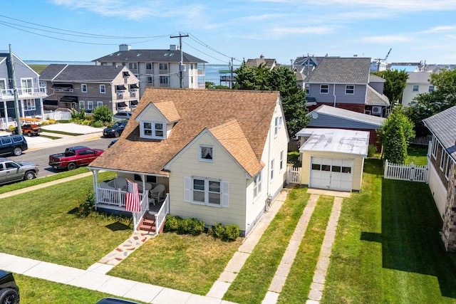 396 95th St, Stone Harbor, NJ 08247 - view of front facade featuring a residential view, driveway, covered porch, a garage, and a shingled roof