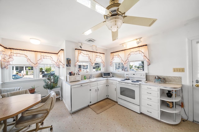 396 95th St, Stone Harbor, NJ 08247 - kitchen with white appliances, plenty of natural light, and light countertops