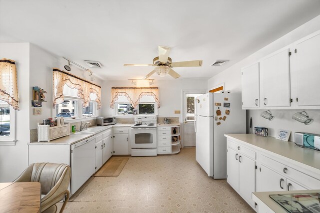 396 95th St, Stone Harbor, NJ 08247 - kitchen featuring white appliances, light countertops, white cabinets, and ceiling fan