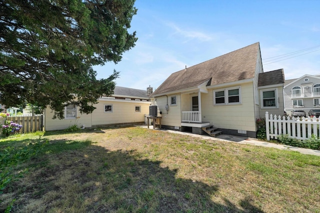 396 95th St, Stone Harbor, NJ 08247 - back of house featuring a shingled roof