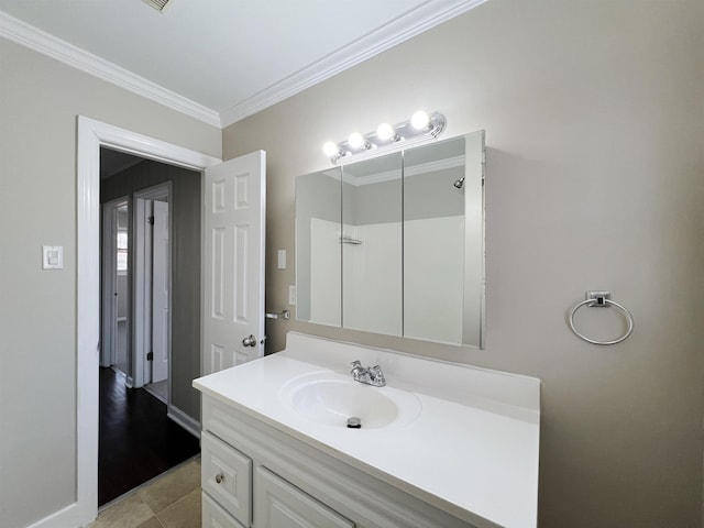 bathroom featuring vanity and crown molding