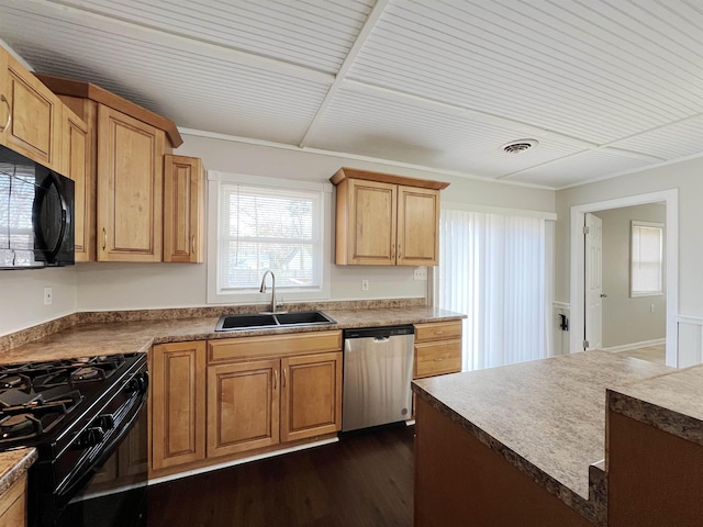 kitchen with dark hardwood / wood-style floors, sink, and black appliances