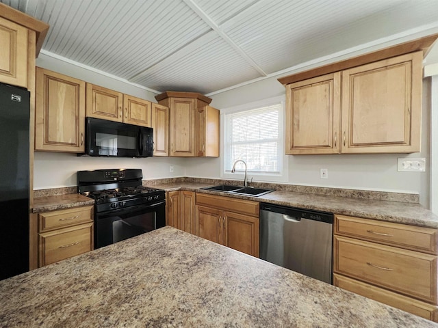 kitchen with light brown cabinetry, sink, and black appliances